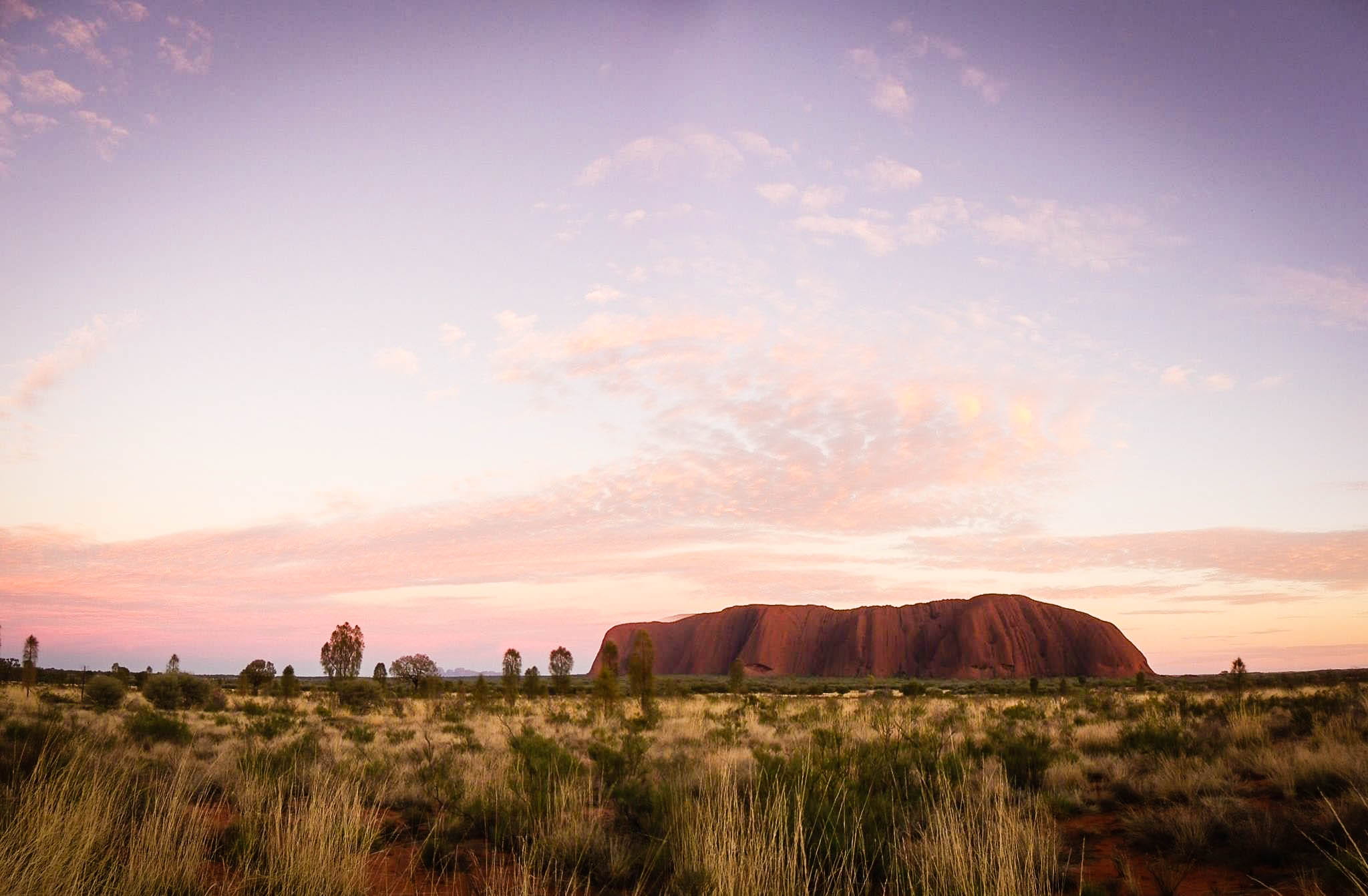 Seeing the changing colours of Uluru at sunrise