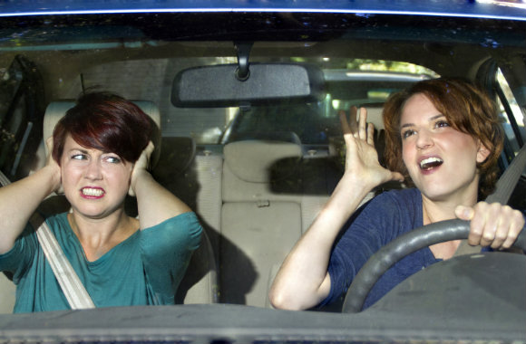 Driver singing on road trip