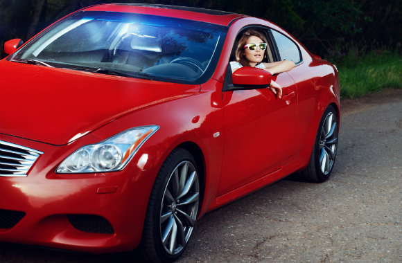 woman driving a sporty car