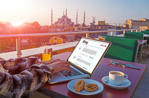 writing a blog at rooftop cafe